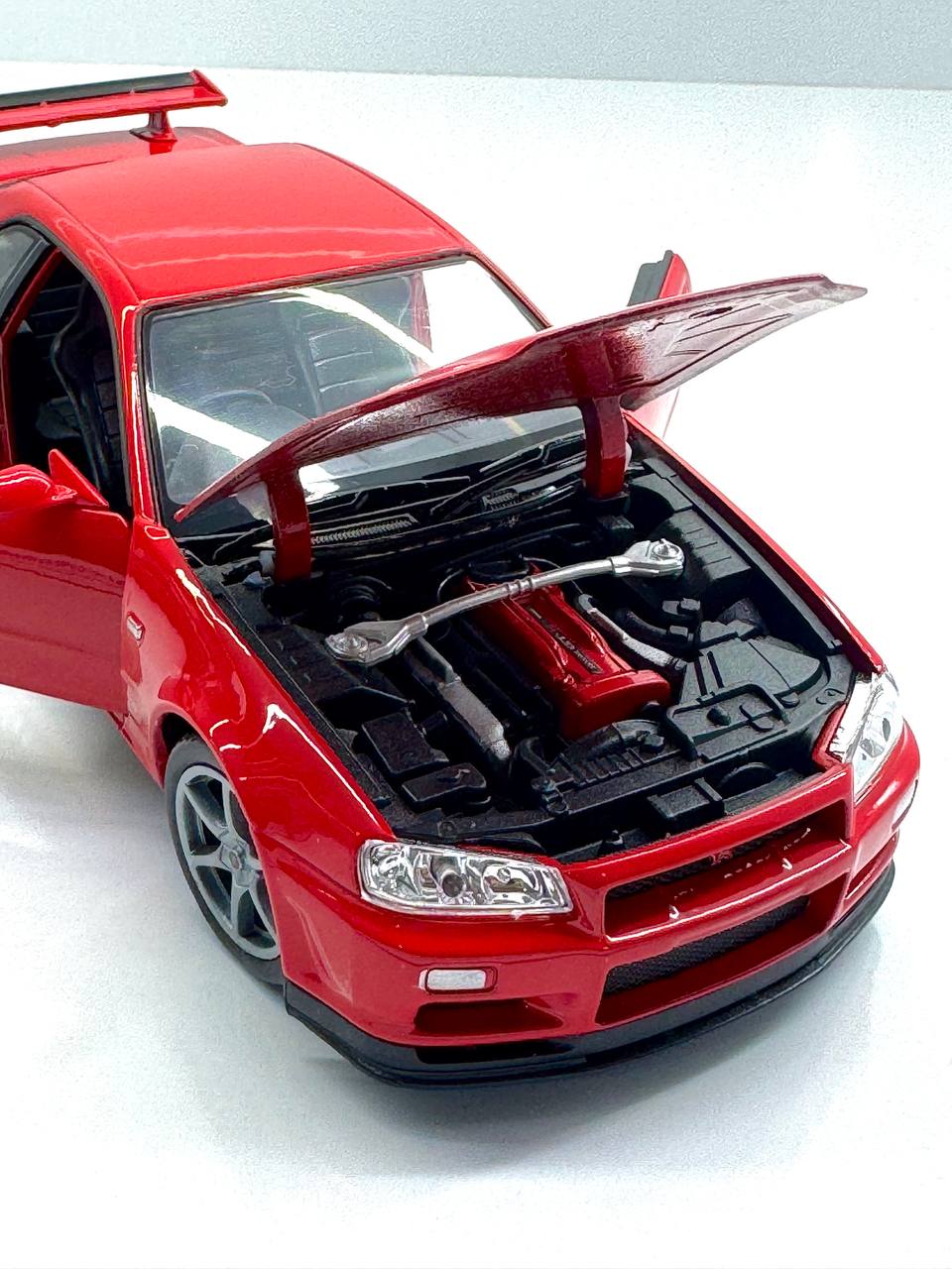 ماکت ماشین فلزی نیسان جی تی آر (Nissan Skyline GT‑R R34) ویلی مقیاس 1.24